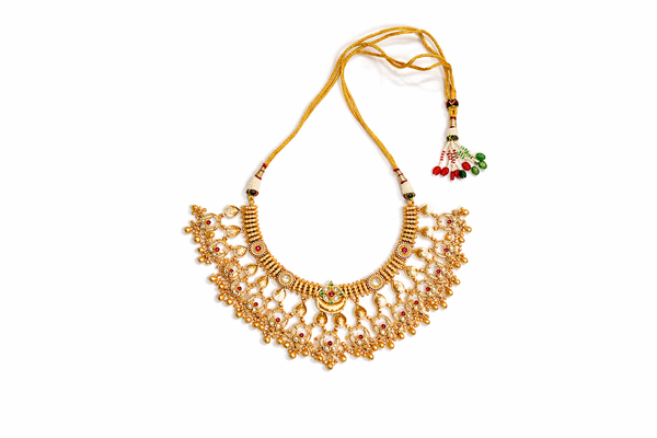Intricate temple pattern layered collar necklace and earrings